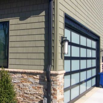 Corner of garage with stone and vinyl siding